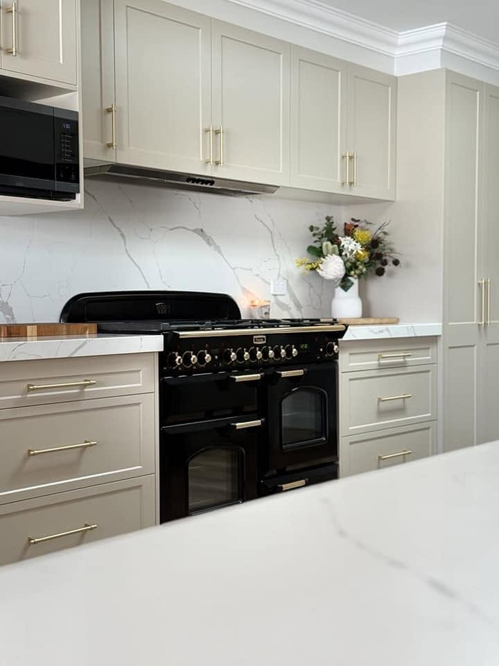 A black range cooker in a real Fabrite Kitchens custom kitchen
