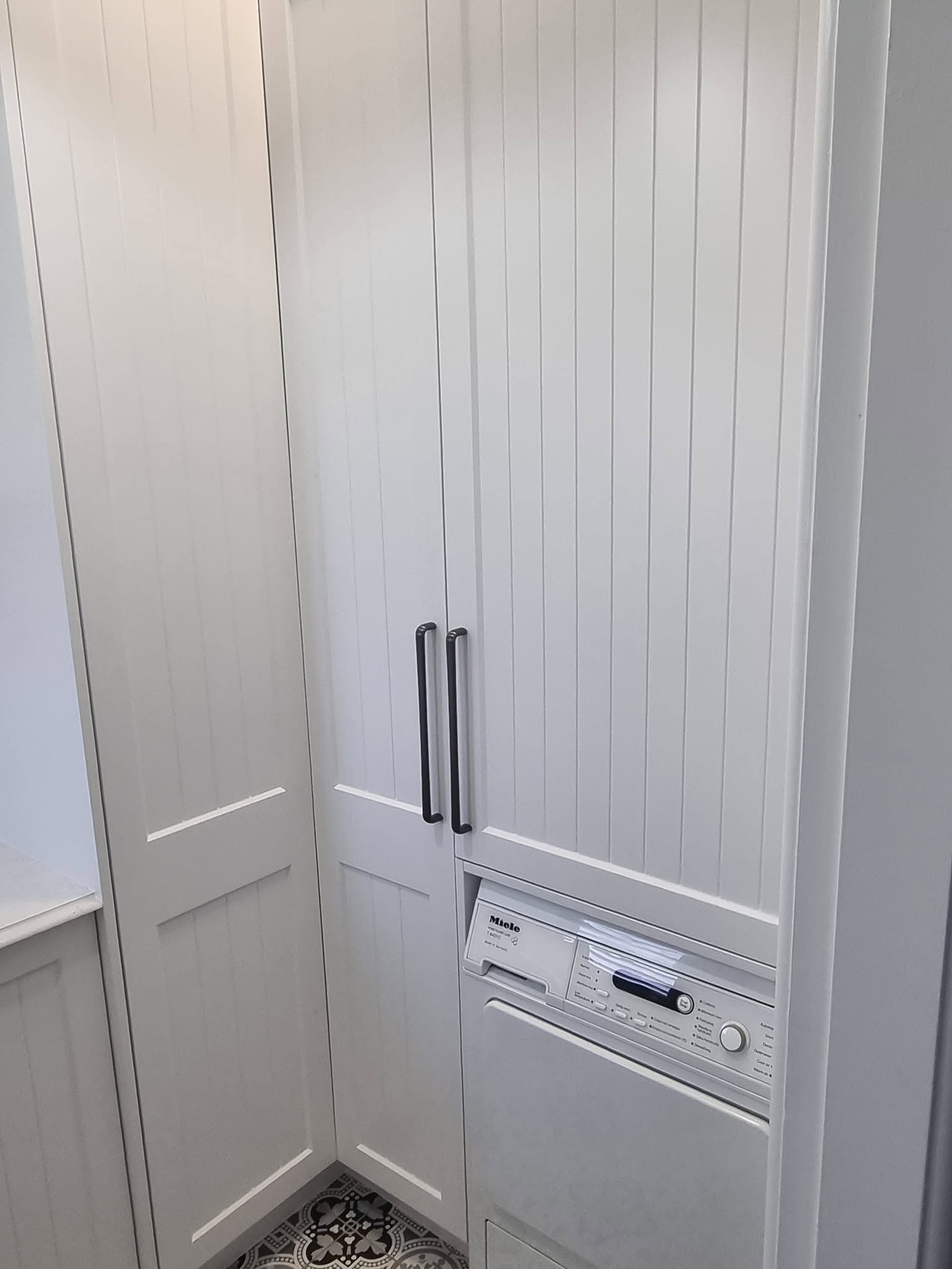 Tall white custom cabinetry detail